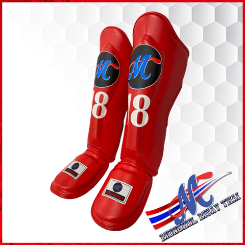 Muay Thai shin guards, They are usually made from a combination of foam, leather, and plastic, and come in a variety of sizes and styles. They are designed to reduce the risk of injury.