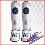 White shinguards with the Thai flag logo number 18 and Sakyan meaning luck & protect The white with Mongkol original Logo M