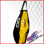Unfilled Mongkol balloon-style bag. A balloon-style muay Thai bag is a large,  punching and kicking bag designed for use in muay Thai black and yellow
